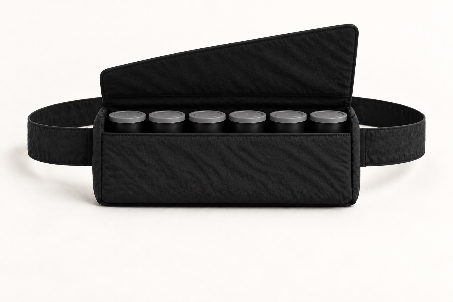 Open Film bag concept with six closed film canisters standing upright in one snug row.