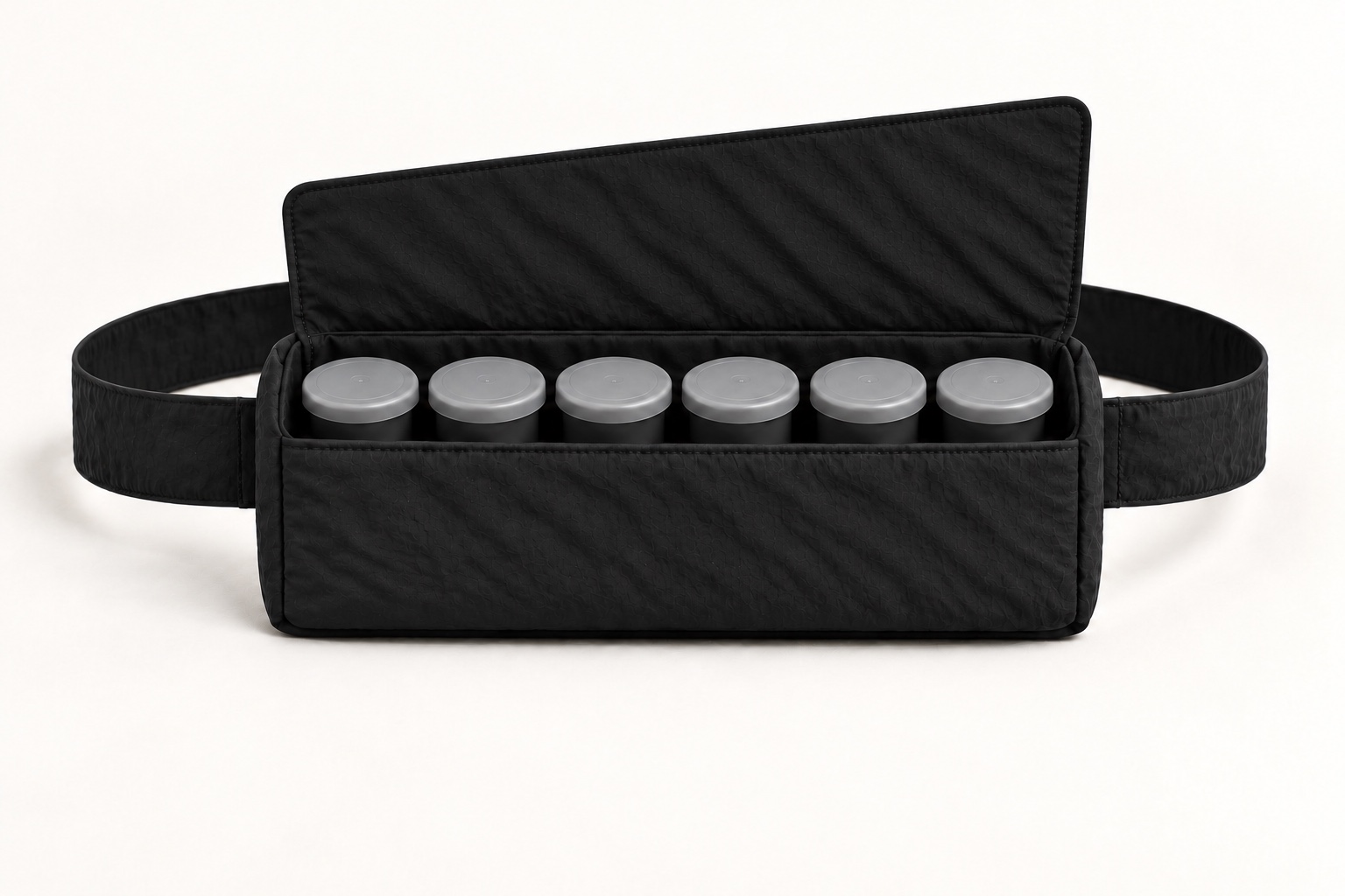 Open Film bag concept with six closed film canisters standing upright in one snug row.
