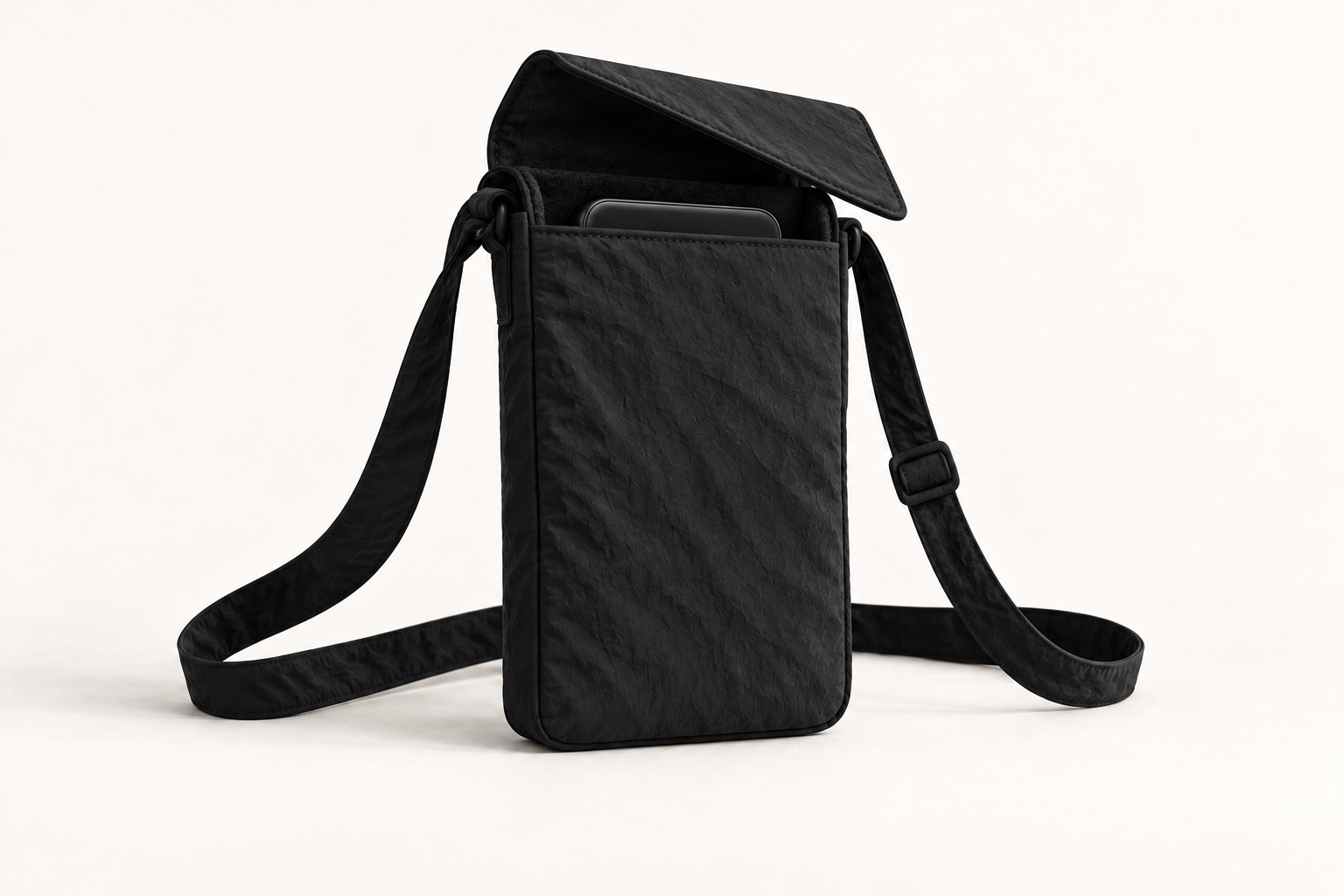 Open phone pouch concept showing a phone edge in its softly lined compartment.